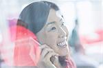 Close up smiling businesswoman talking on cell phone