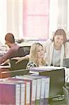 Fashion designers working at desk in office