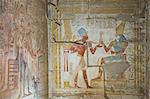 Bas relief of Pharaoh Seti I making an offering to the seated God Horus on right, Temple of Seti I, Abydos, Egypt, North Africa, Africa