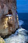 Bar built in cliff caves, Cova d'en Xoroi in evening, Cala en Porter, Menorca, Balearic Islands, Spain, Mediterranean, Europe