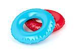 Blue and red swim rings on white background
