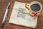 choose to be optimistic, it feels better - motivational handwriting on a  napkin with a cup of coffee