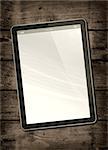 Digital tablet PC on a dark wood table - vertical office mockup