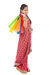 Indian people in traditional sari shopping for diwali festival, full length standing isolated on white background.