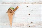 Top view single chocolate ice cream on vintage wooden background. Copy space at side.