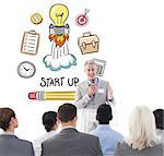 Businessman doing speech during meeting  against start up doodle