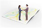 Two businesswomen shaking hands against city map