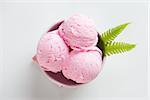 Top view scoop pink ice cream in bowl on white background.