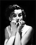 1950s SCARED FRIGHTENED BRUNETTE WOMAN ABOUT TO SCREAM IN FEAR