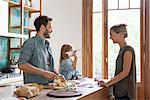 Family spending time together in kitchen