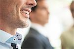 Businessman smiling, close-up