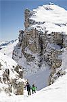 Ski mountaineers climbing on snowy mountain, Val Gardena, Trentino-Alto Adige, Italy