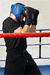 Boxer covering his face in ring