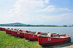 Numbered boats docked by lake