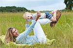 Mother and son playing in grass