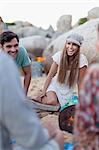 Friends sitting on beach together