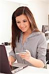 Businesswoman shopping online at desk