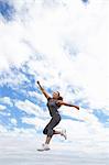 Runner jumping for joy outdoors