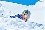 Boy playing in snow, Chamonix, France