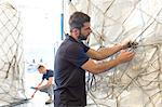 Workers preparing freight in air freight warehouse