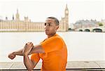 Male runner preparing on Southbank, London, UK