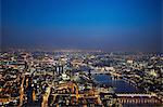 Aerial cityscape of river Thames at night, London, England, UK