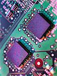 Close up detail of green and purple computer circuit board