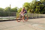 Young couple together on bicycle