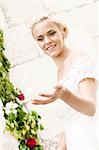 Happy bride playing with soap bubbles