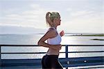 Young woman jogging on the waterfront, Adriatic Sea, Croatia