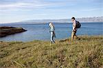 Young couple hiking along coastal path