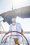 Man steering sailboat, Adriatic Sea