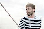 Man listening to music on sailboat, Adriatic Sea