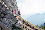 Group of friends hiking in mountain landscape