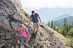 Young couple hiking in mountain landscape