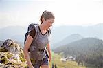 Young woman hiking in mountain landscape