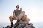 Young couple resting on mountain peak