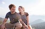 Young couple having fun on mountain peak