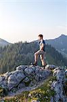 Young man overlooking mountain landscape