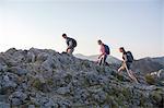 Group of friends hiking in mountain landscape