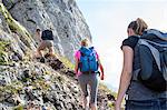 Group of friends hiking in mountain landscape