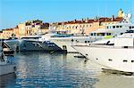 Luxurious motor yachts harboring in the marina of St.-Tropez, Var, Provence Alpes Cote d' Azur region, France, Europe