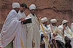 Priests singing during Easter Orthodox Christian religious celebrations in the ancient rock-hewn churches of Lalibela, Ethiopia, Africa