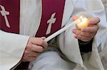 Lighting a candle on Day celebration of forgiveness, Amiens Cathedral, Picardy, France, Europe