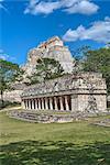 Columns Building in foreground with Pyramid of the Magician beyond, Uxmal, Mayan archaeological site, UNESCO World Heritage Site, Yucatan, Mexico, North America