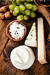 Cheese variety.Food background.  Fresh ingredients on wood