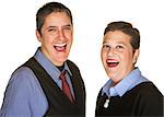 Laughing lesbian couple in blue shirts on isolated background