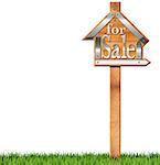 Wooden and metallic sign in the shape of house with text for sale and wooden pole. For sale real estate sign isolated on white background with green grass