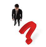 Businessman with a big red question mark