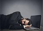 Businessman workload falls asleep tired on computer